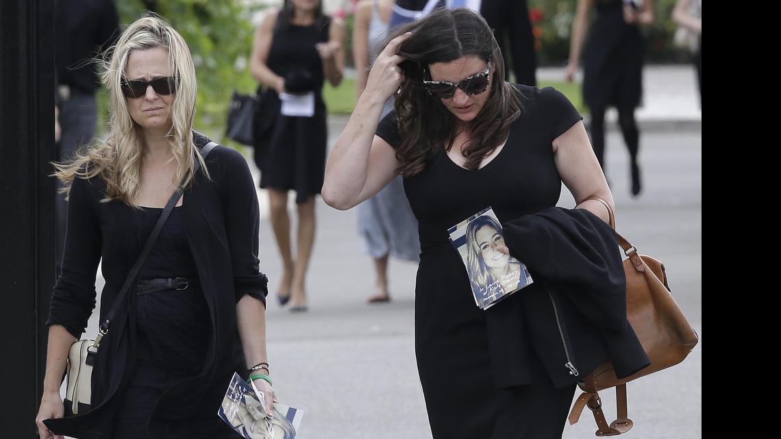 
Two women walk toward the parking lot after a memorial service for Kathryn Steinle in Pleasanton, Calif., Thursday, July 9, 2015. Steinle, of San Francisco, was gunned down by Juan Francisco Lopez Sanchez on July 1 while walking along a city pier with her father.
