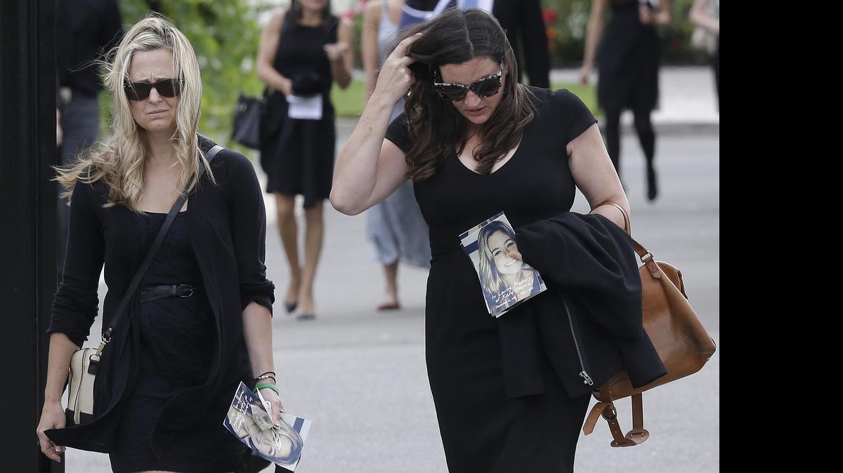 
Two women walk toward the parking lot after a memorial service for Kathryn Steinle in Pleasanton, Calif., Thursday, July 9, 2015. Steinle, of San Francisco, was gunned down by Juan Francisco Lopez Sanchez on July 1 while walking along a city pier with her father.
