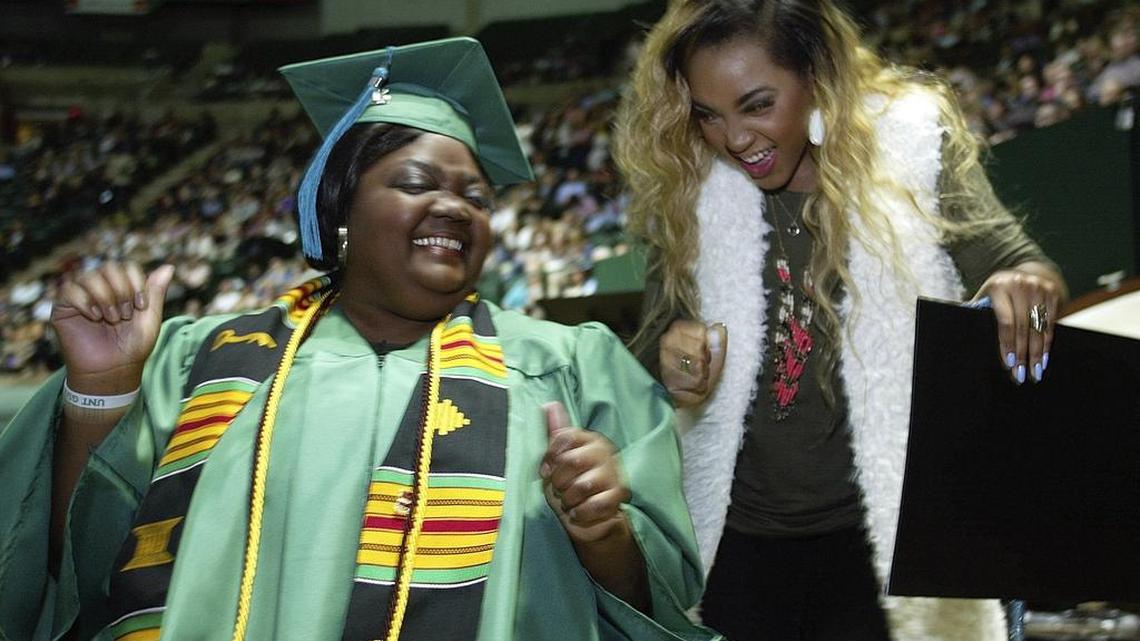 Darla Ray and daughter Whitley Smith share a moment after Ray walked the stage for graduation at the University of North Texas.
