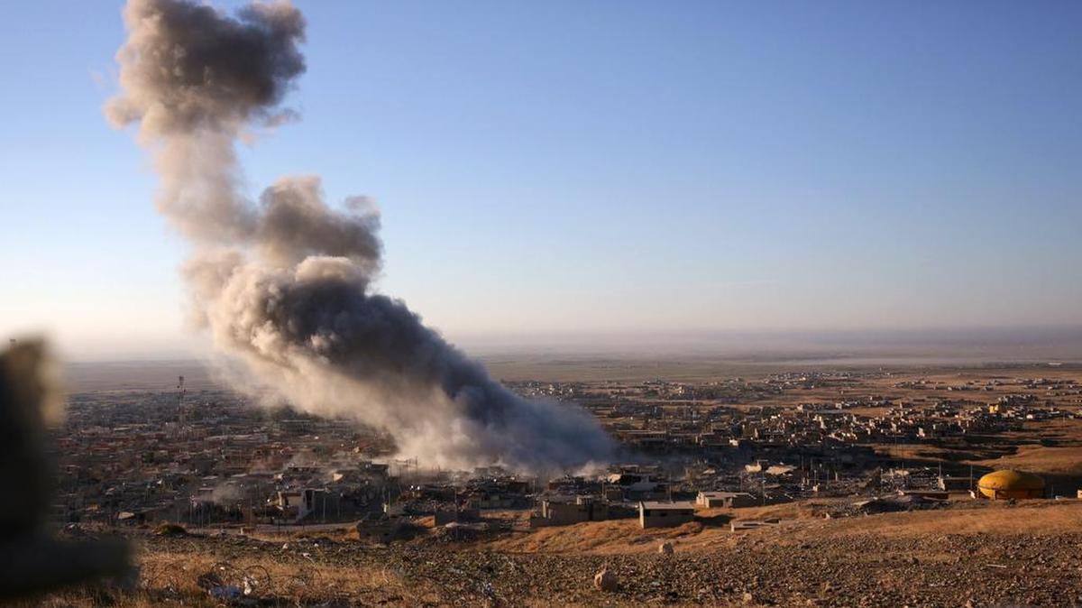 Smoke believed to be from an airstrike billows over the northern Iraqi town of Sinjar on Thursday, Nov. 12, 2015. Kurdish forces touted the recent operation to push Islamic State group fighters out of the town as a major military victory. But commanders on the ground say IS forces largely withdrew, fleeing during a pause in airstrikes, suggesting that the extremist group is capable of pragmatism when badly outgunned.