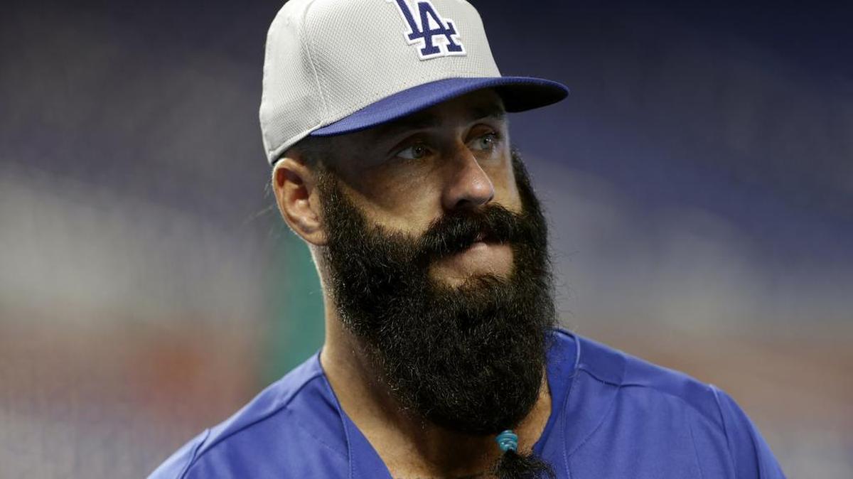 FILE - This Aug. 20, 2013 file photo shows Los Angeles Dodgers relief pitcher Brian Wilson watching batting practice before a baseball game against the Miami Marlins, in Miami.