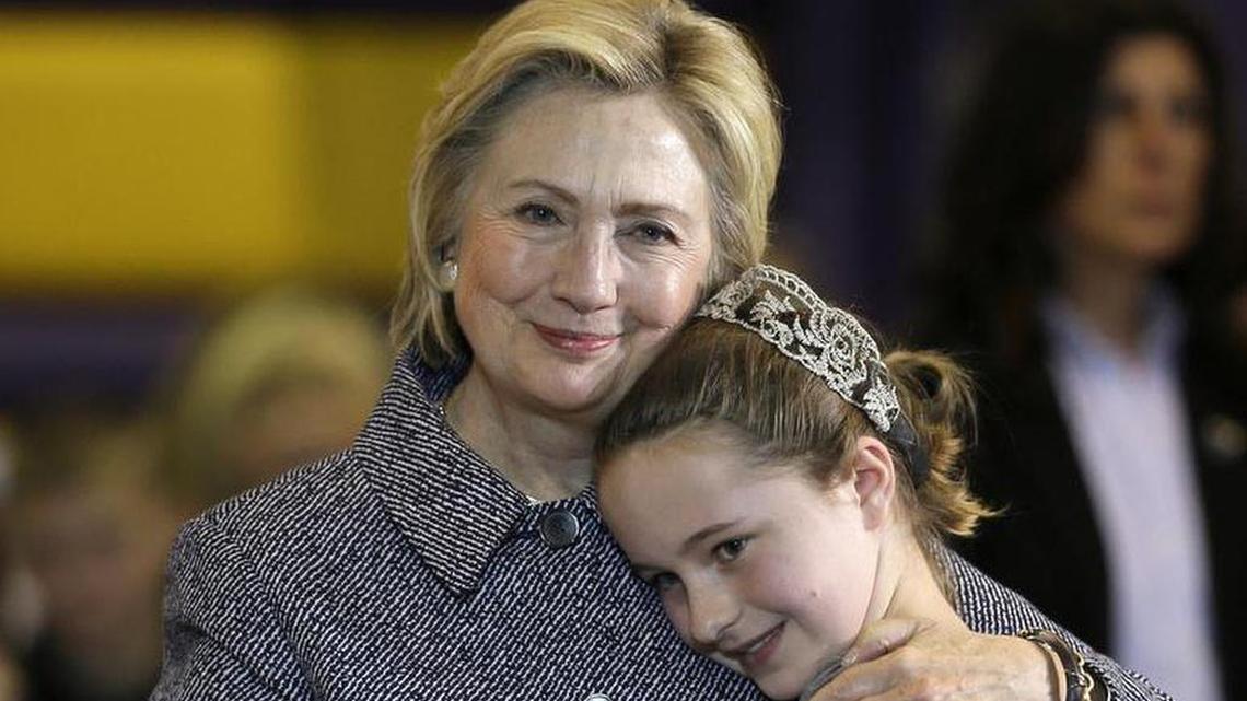 Democratic presidential candidate Hillary Clinton hugs fifth-grader Hannah Tandy during a Dec. 22, 2015, town hall meeting at Keota High School in Keota, Iowa. Before about 700 people at Keota High School last month, the grade-schooler clutched the microphone during a town hall meeting and asked: “What are you going to do about all this bullying?” Clinton opened her arms for a hug, before telling the crowd that it was “important to stand up to bullies wherever they are.”