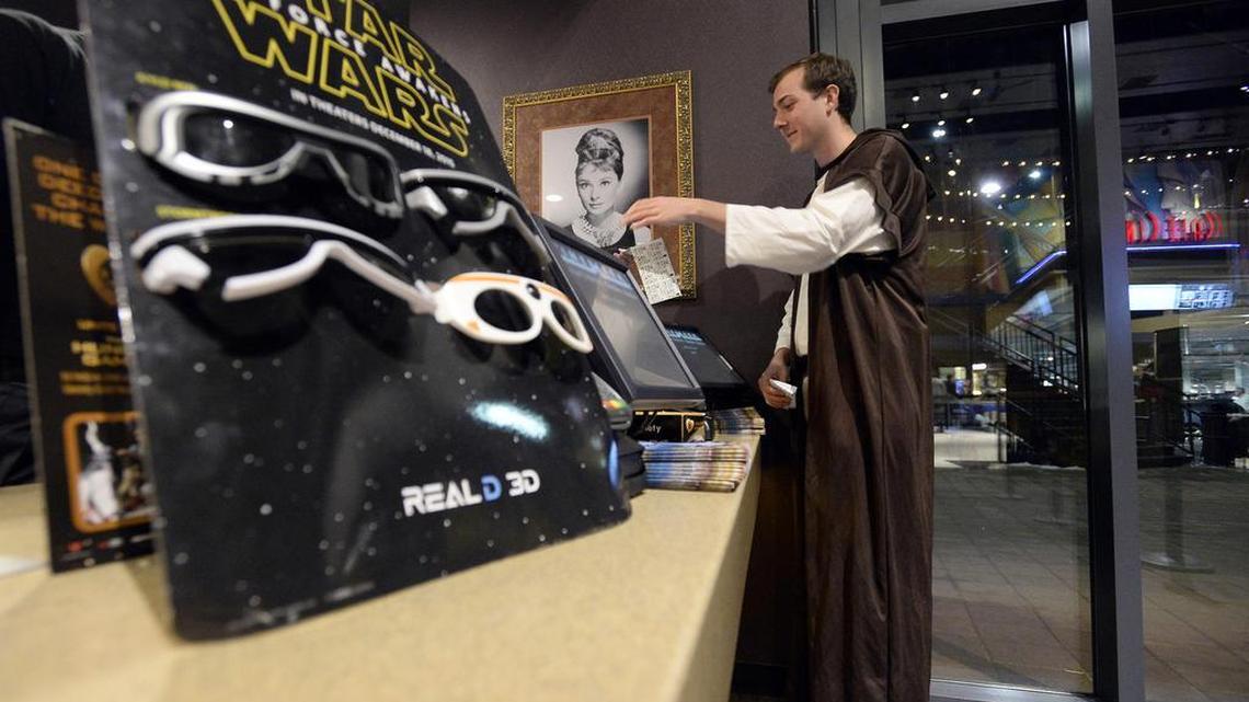 Ian Thom buys his movie ticket dressed as Luke Skywalker during opening night of “Star Wars: The Force Awakens” at Century Theatre in Boulder, Colo., Thursday, Dec. 17, 2015.