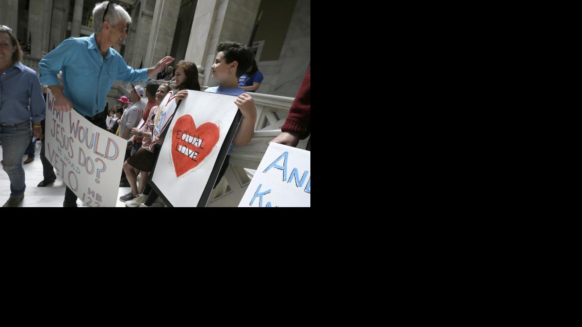 
Protesters gather on the steps near the House chamber at the Arkansas state Capitol in Little Rock, Ark., Monday, March 30, 2015. A House committee earlier Monday advanced an amended version of a bill that opponents say allows discrimination against gays and lesbians. 
