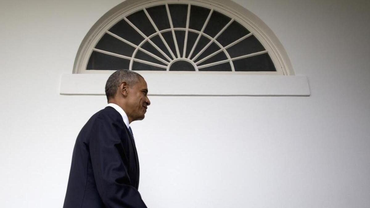 President Barack Obama walks along the colonnade of the White House in Washington, Tuesday, Jan. 12, 2016, to the residence from the Oval Office, hours before giving his State of The Union address.