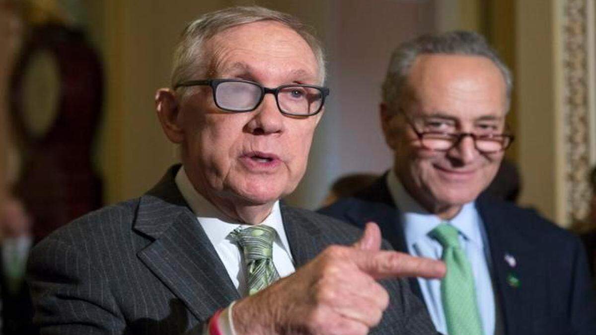 
Senate Minority Leader Harry Reid of Nevada, accompanied by Sen. Charles Schumer, D-N.Y., speaks to reporters on Capitol Hill in Washington, March 17, 2015, following a policy luncheon.
