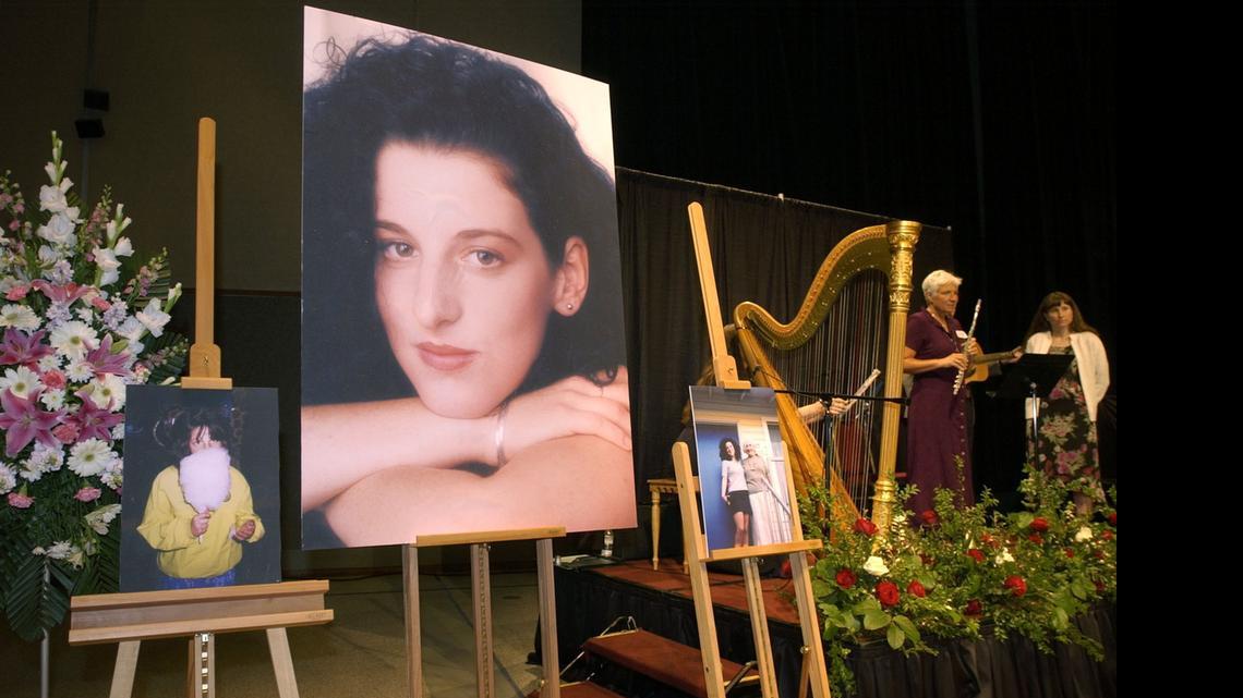 
In this May 28, 2002 file photo taken at the Modesto Centre Plaza in Modesto, Calif. photos of Chandra Levy are on display as musicians, right, stand by at the memorial service for Levy. 
