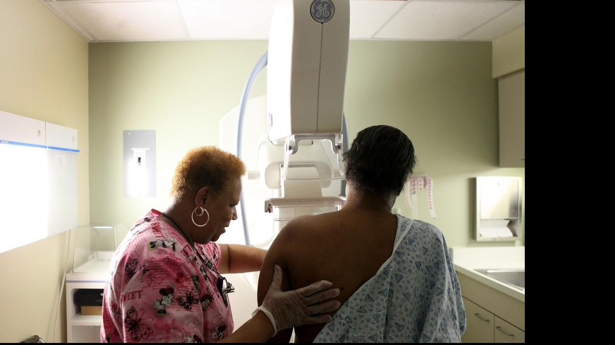 
A woman gets her routine yearly mammogram from Lead Mammography Tech Stella Palmer at Mt. Sinai Hospital in Chicago, February 15, 2012. 
