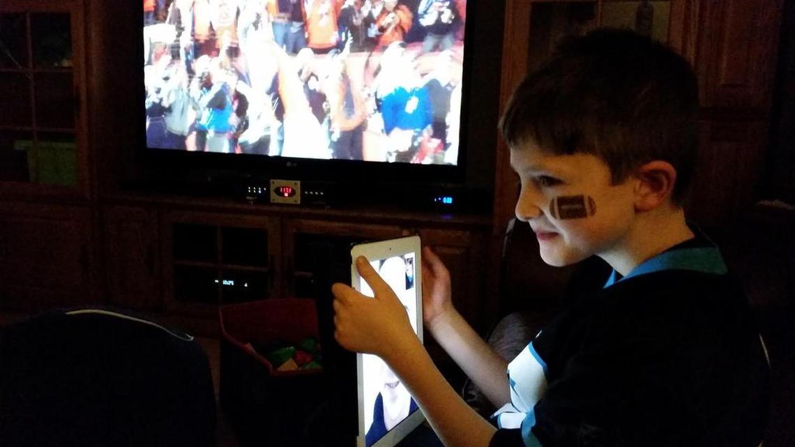 Dane Howard, 7, watched the Super Bowl with his father, Mick MacDonald, who has been deployed for close to a year with a National Guard unit.