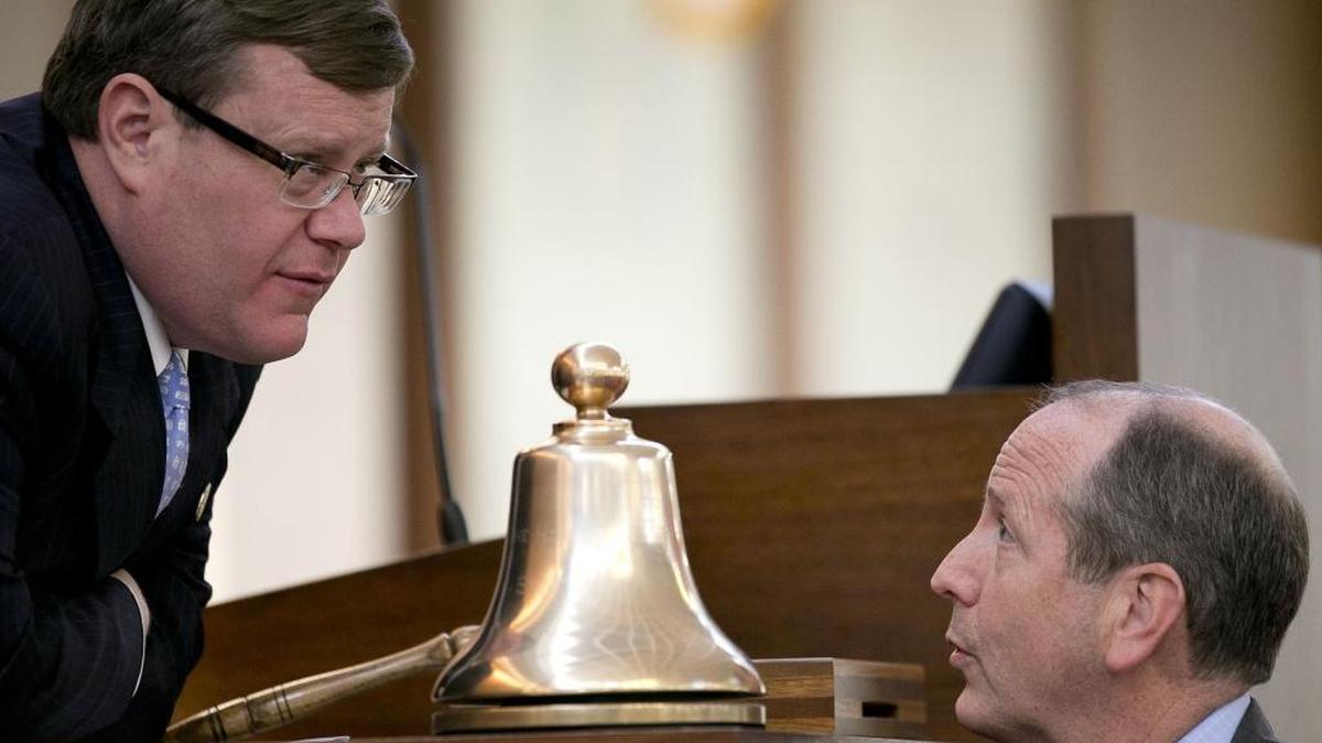 NC House Speaker Tim Moore talks with bill sponsor Rep. Dan Bishop of Mecklenburg County, right, during debate of House Bill 2 on the House floor on Wednesday in Raleigh.