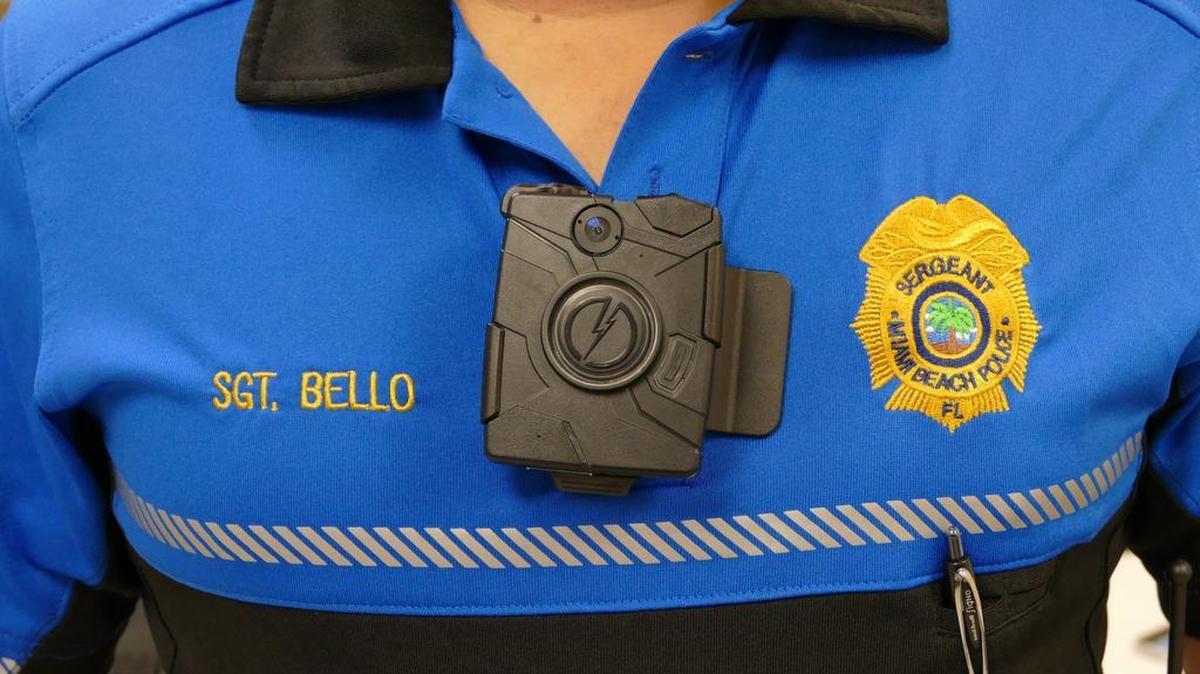 Miami Beach Police Sgt. Alex Bello shows a body camera for officers to use on patrol at a press conference last year. Use of a cam in court by another officer created a legal dispute.