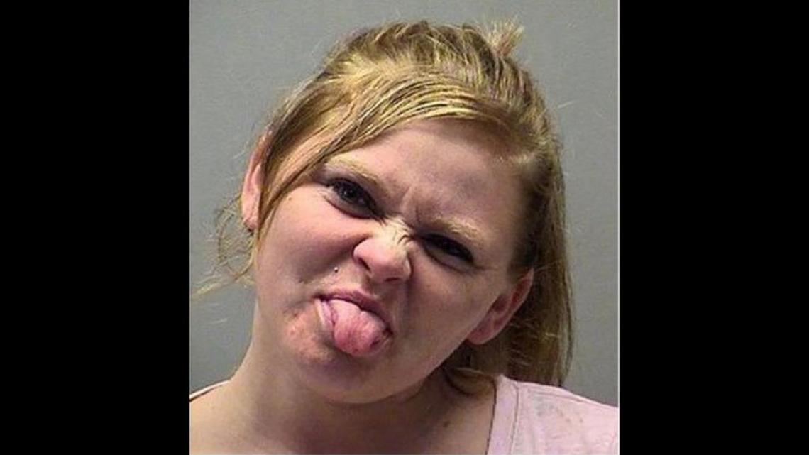 A woman was arrested in Huber Heights, Ohio, after police say she demanded a friend repay a $20 debt and then threatened to burn down her house before driving away drunk.