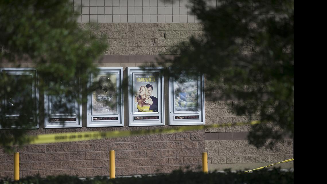 
A movie poster for "Trainwreck" hangs with police tape surrounding it at the Grand Theater following a deadly shooting, July 24, 2015, in Lafayette, La. John Russell Houser stood up about 20 minutes into the showing of "Trainwreck" and fired on the audience with a semi-automatic handgun. 

