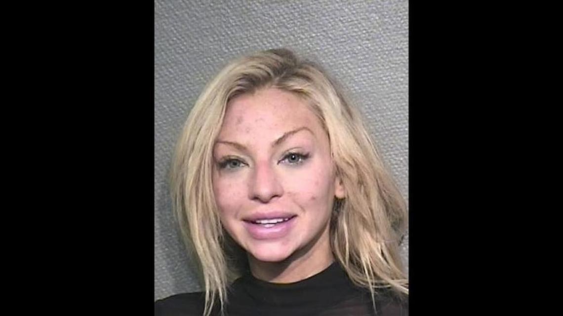 A Texas woman destroyed at least $300,000 in famous art at the home of Houston attorney Tony Buzbee after their first date, prosecutors say.