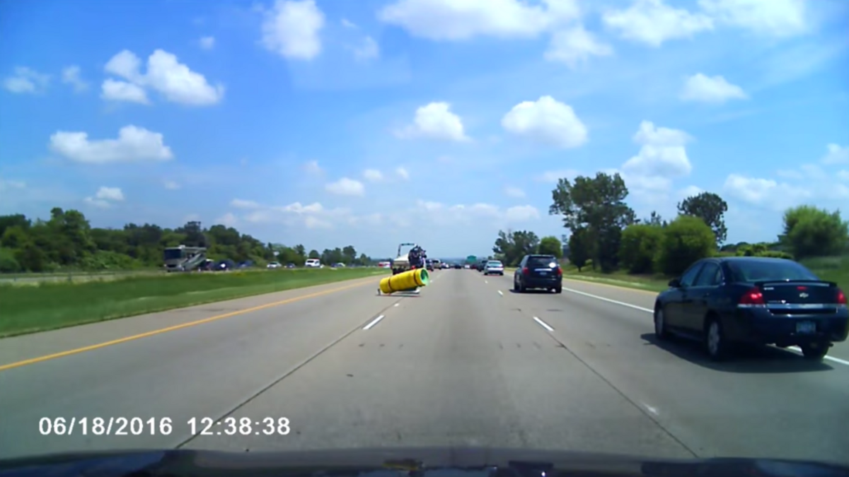 A video posted Monday shows the motorcycle flipping over a foam pad that fell off the back of a boat.