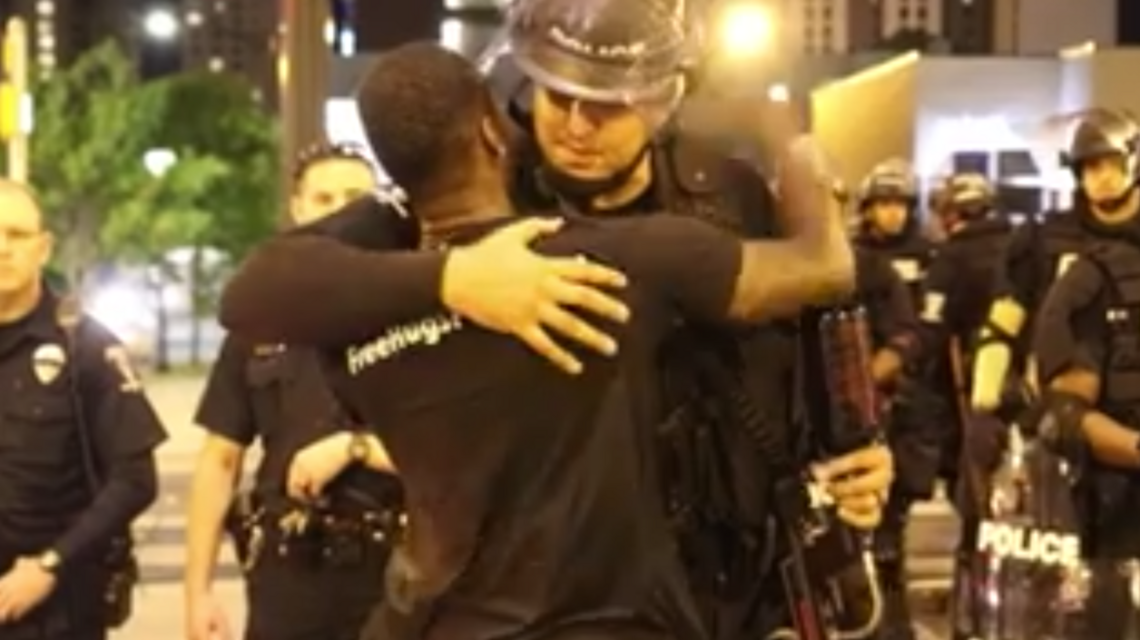 One man tried a new tactic to defuse the Charlotte riots: Free hugs