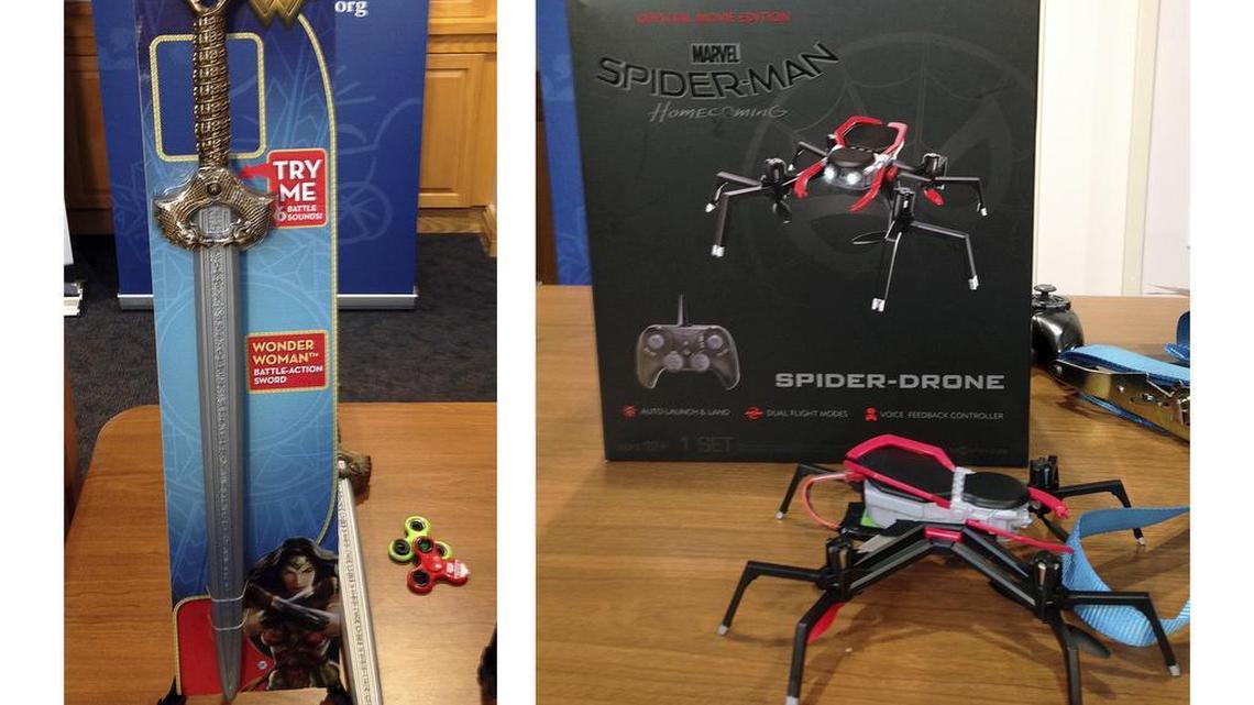 Mattel’s Wonder Woman sword, left, has the potential to cause blunt-force injuries according to the child safety group WATCH. Marvel’s Spider-Man drone, right has multiple rotating blades that can lead to eye and other bodily injuries, the group said.