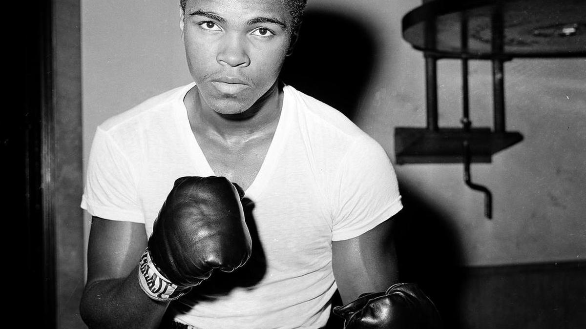 In this Feb. 8, 1962, file photo, young fighter Cassius Clay (Muhammad Ali) is seen at City Parks Gym in New York. Ali, the magnificent heavyweight champion whose fast fists and irrepressible personality transcended sports and captivated the world, has died according to a statement released by his family Friday, June 3, 2016. He was 74.