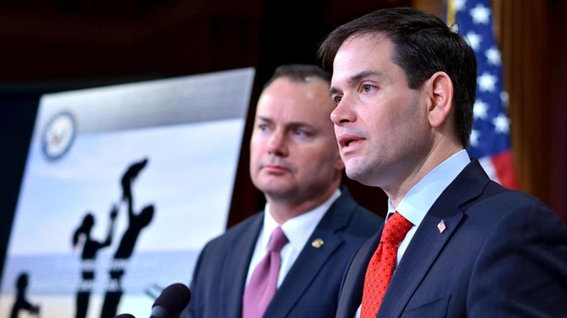 
U.S. Sens. Mike Lee of Utah and Marco Rubio of Florida discuss an overhaul of the nation's corporate and individual tax systems during a Washington press conference March 4, 2015. Their proposal, which has not yet formally been introduced to Congress, would cut corporate tax rates and flatten the number of individual tax brackets. Analysts estimate that Rubio’s plan would cost $6 trillion, elevating the national debt for 25 years.
