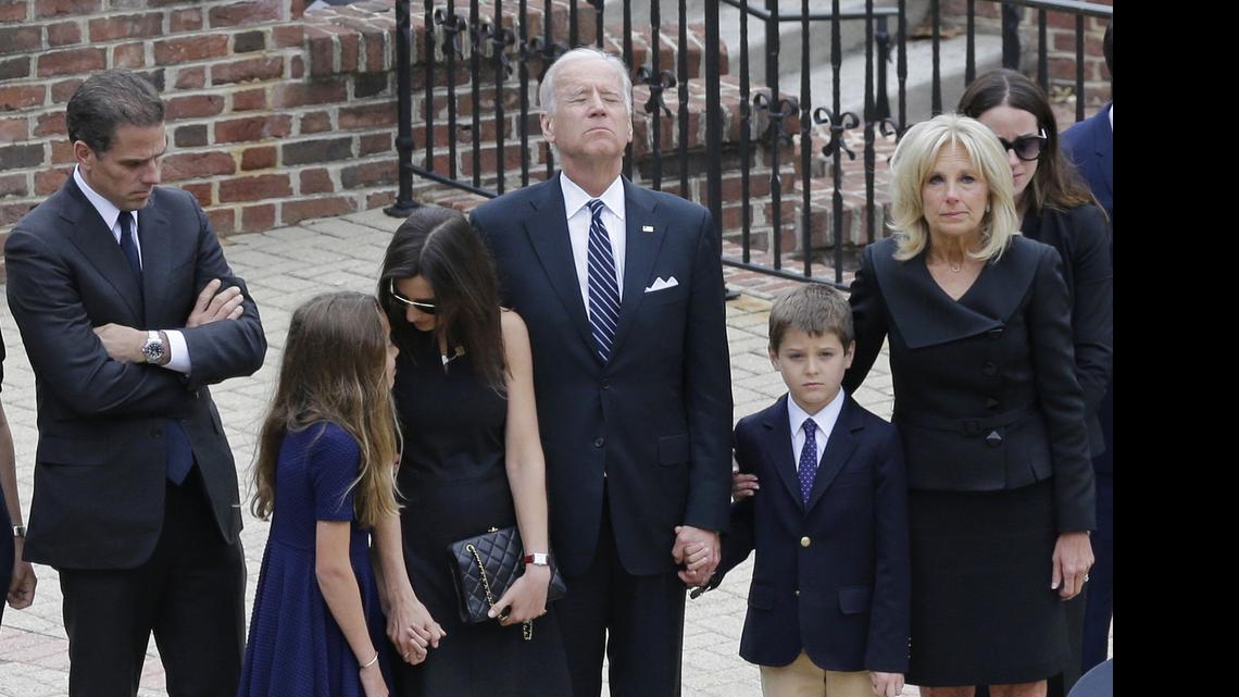 
Vice President Joe Biden, center, pauses alongside his family as they to enter a visitation for his son, former Delaware Attorney General Beau Biden on Thursday at Legislative Hall in Dover, Del. Standing with Biden are, from left, his son Hunter, granddaughter Natalie, daughter-in-law Hallie, grandson Hunter and wife Jill. Beau Biden died of brain cancer Saturday at age 46.
