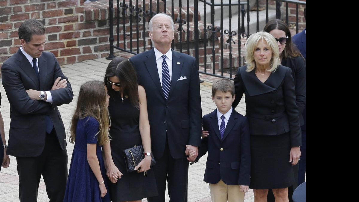 
Vice President Joe Biden, center, pauses alongside his family as they to enter a visitation for his son, former Delaware Attorney General Beau Biden on Thursday at Legislative Hall in Dover, Del. Standing with Biden are, from left, his son Hunter, granddaughter Natalie, daughter-in-law Hallie, grandson Hunter and wife Jill. Beau Biden died of brain cancer Saturday at age 46.
