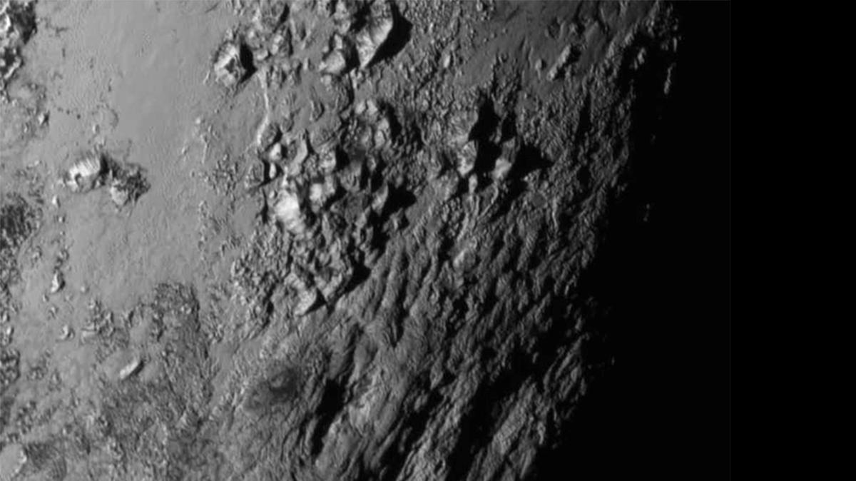 
This image provided by NASA shows a region near Pluto’s equator with a range of mountains captured by the New Horizons spacecraft. 
