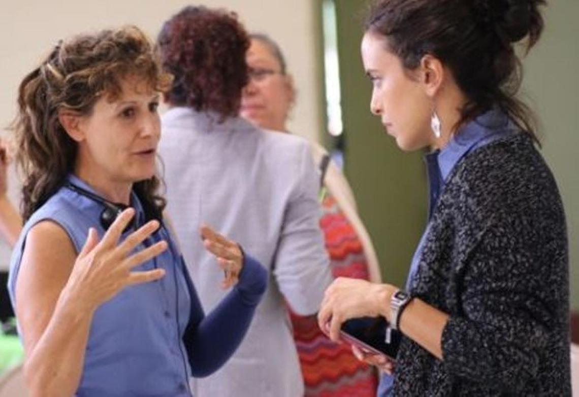 Celeste Monforton, a former U.S. Department of Labor official and an adjunct professor of occupational and environmental health, at left speaking with a labor activist last year in Morganton, N.C.