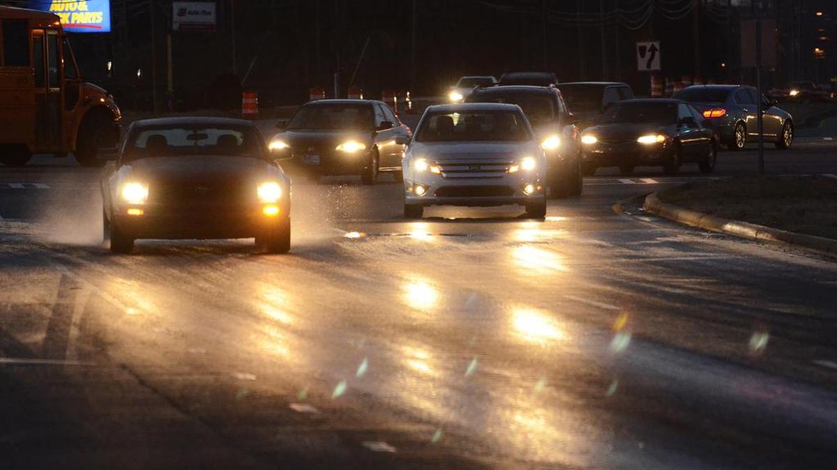 File Photo: Vehicles try to navigate an icy patch in Charlotte, NC.