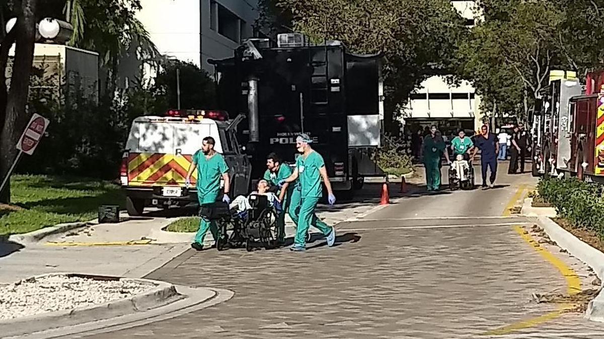 Residents are evacuated from the powerless Hollywood Hills Nursing Home, 1200 N 35th Ave., on Wednesday morning.