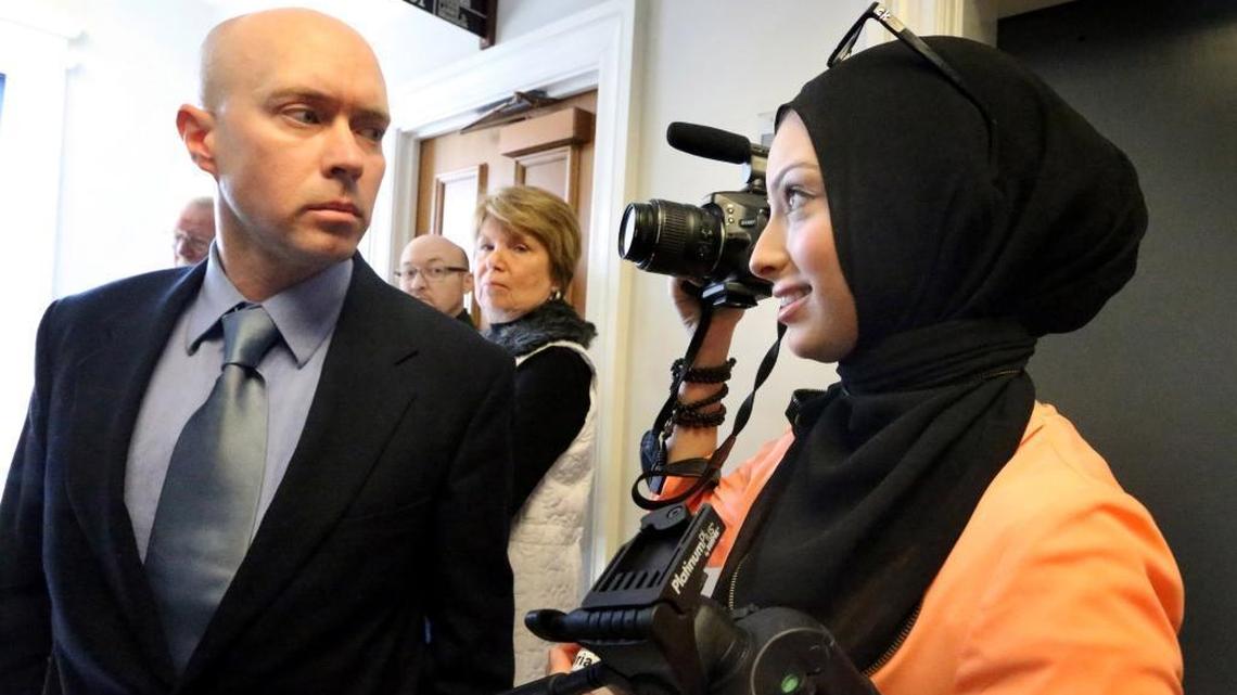 Micah Forrest blocks then-journalism-student Noor Tagouri from filming outside the courtroom of Chancellor Robert Corlew III, in Murfreesboro, Tenn., on March 24, 2014, after Corlew excused himself from a case challenging the Islamic Center of Murfreesboro cemetery approval by the Rutherford County Board of Zoning Appeals at the Rutherford County Judicial Building.