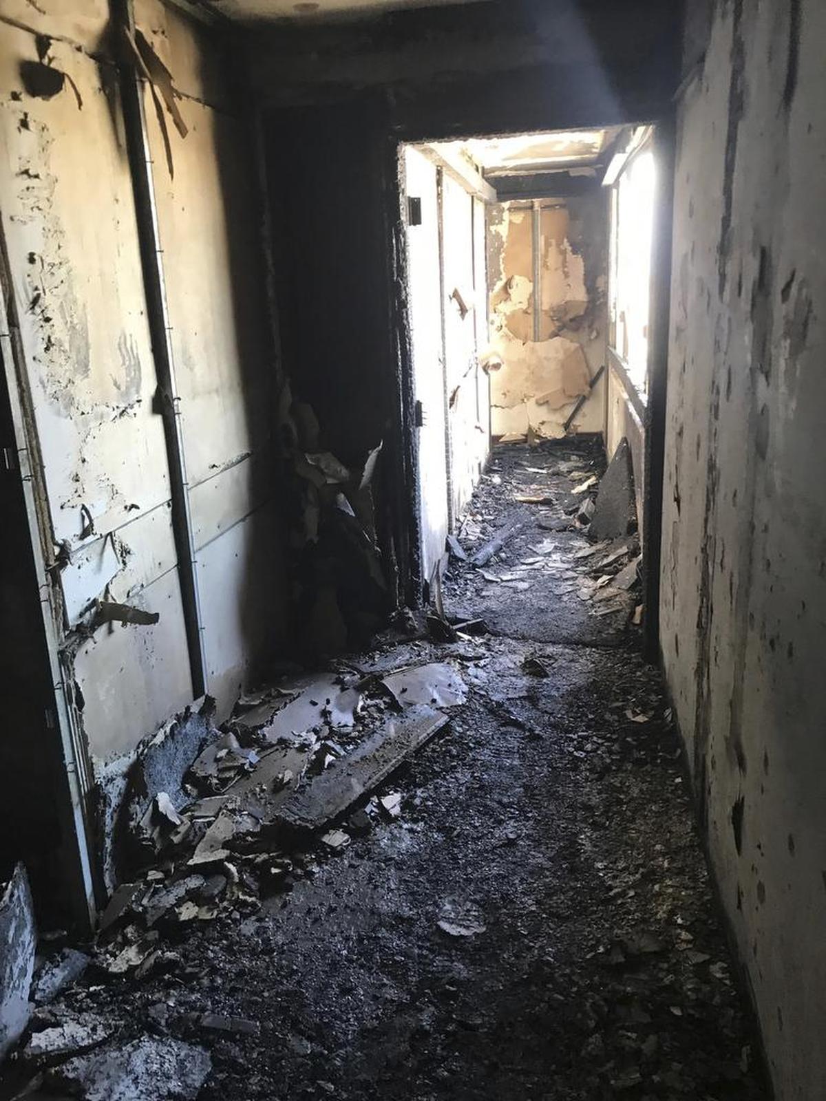 This photo provided by Bruce Campbell, a unit manager in the Marco Polo building in Honolulu, shows the charred interior of the building on Saturday, July 15, 2017. A fire broke out Friday afternoon in a unit on the 26th floor, where all three of the dead were found, Fire Chief Manuel Neves said.