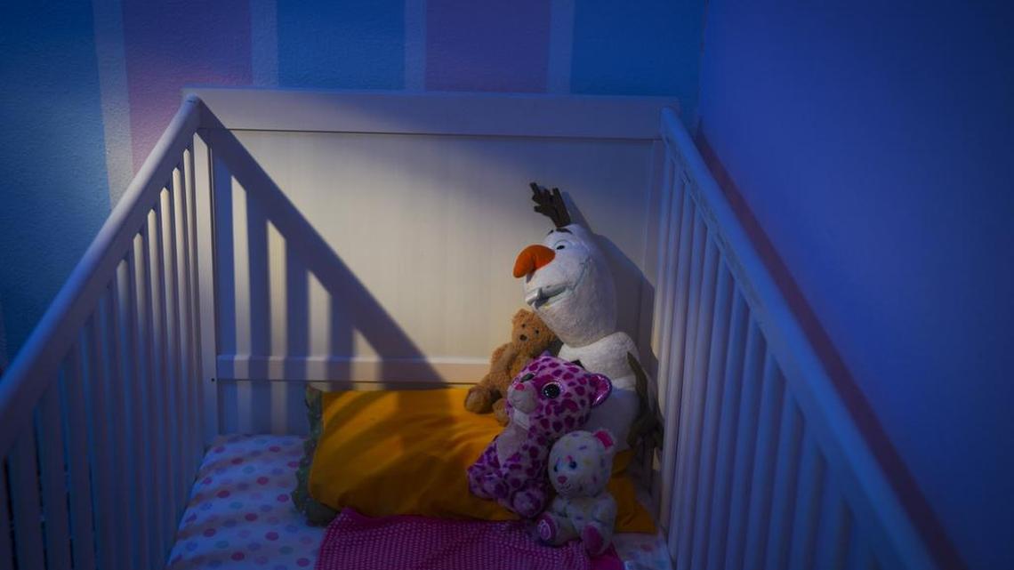 Stuffed animals sit on a bed at Saira Khan's home for her niece, the daughter of Syed Rizwan Farook and Tashfeen Malik.