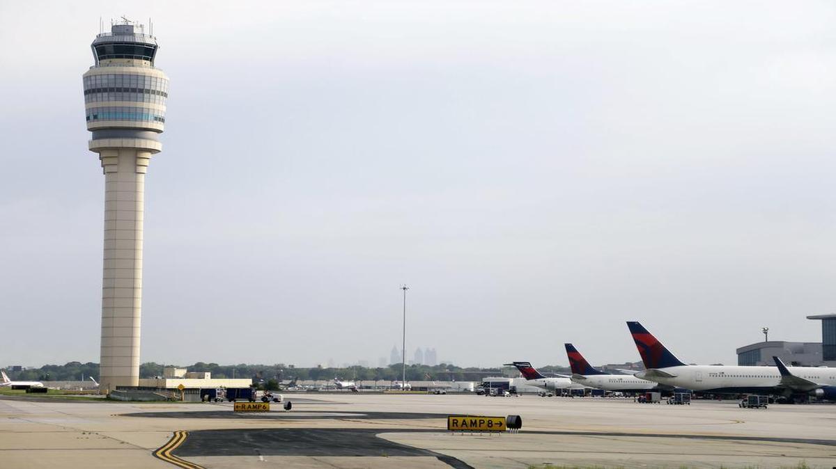 An air traffic control tower is shown at Hartsfield-Jackson Atlanta International Airport in 2016. With a broken throttle Cathy Lewan, the pilot of a small plane, found herself over the world’s busiest airport and facing calamity, but air traffic controllers guided her to a safe landing on Feb. 14, 2016. On Tuesday, March 14, 2017, Lewan had a reunion with the Atlanta air traffic controllers who were her lifeline.