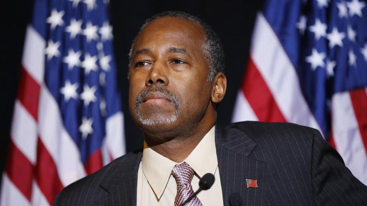 In this Nov. 16, 2015 photo, Republican presidential candidate Dr. Ben Carson speaks at a news conference in Henderson, Nev. Carson is making a post-Thanksgiving trip to visit Syrian refugees in Jordan this weekend.