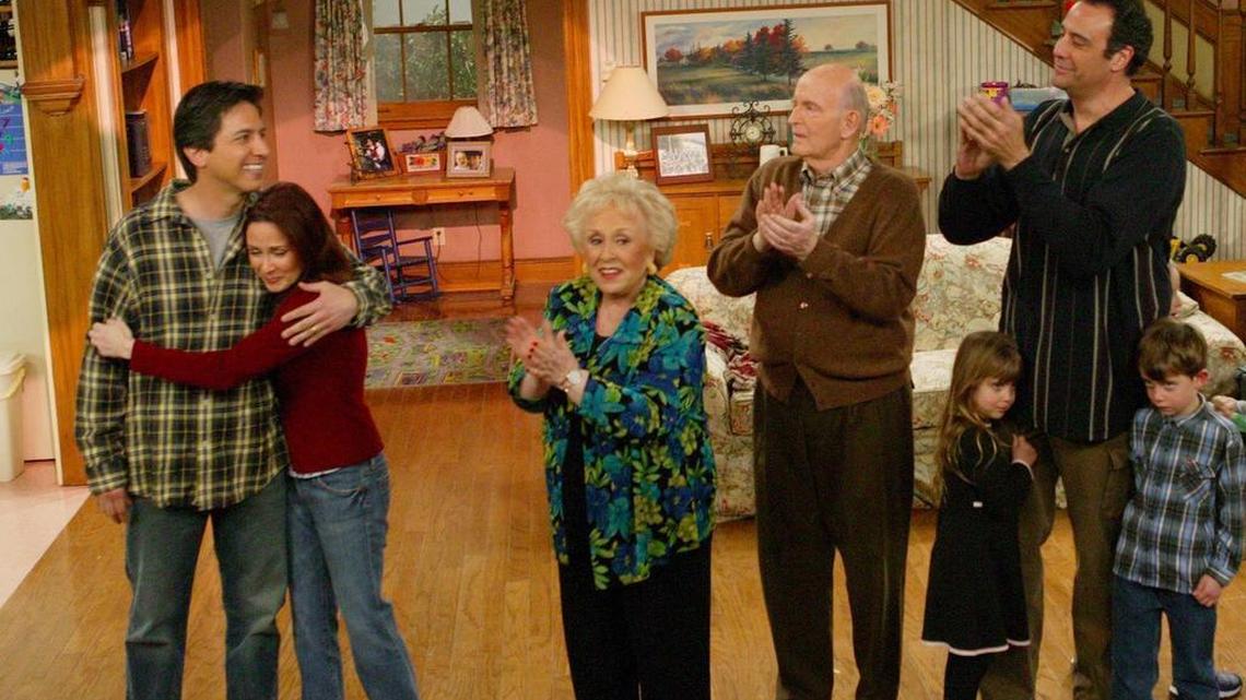 The cast of "Everybody Loves Raymond" applauds at the taping of the final episode of the show at Warner Bros. Studios in Burbank, Calif., in 2005. Cast members from left are Ray Romano, Patricia Heaton, Doris Roberts, Peter Boyle, Brad Garrett with his two children. Roberts died Sunday at age 90.