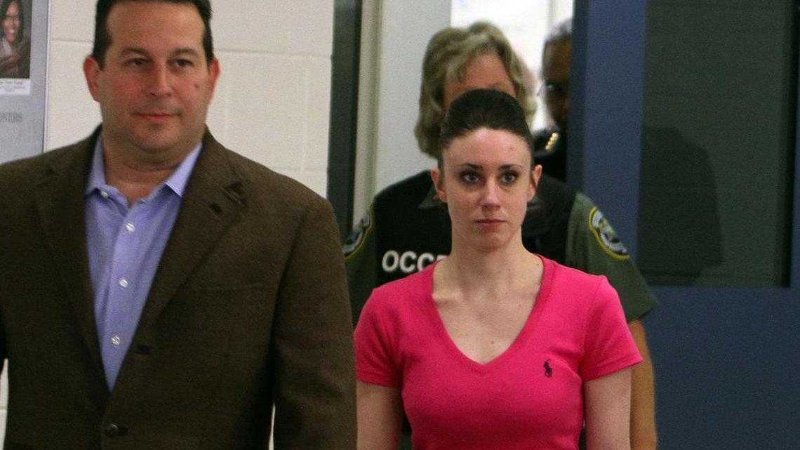 Attorney Jose Baez, left, escorts Casey Anthony as she leaves the Orange County Corrections Facility on Sunday, July 17, 2011, in Orlando.