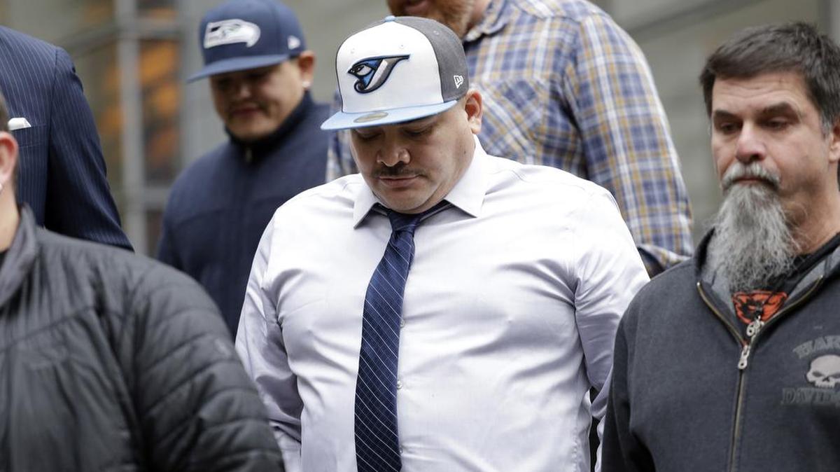 Raymond Fryberg exits the U.S. District Court after his sentencing Monday in Seattle. Fryberg, the father of a teenager who used his dad's gun to kill four classmates and then himself at a Washington state high school, was sentenced to two years in prison on firearms charges. He was convicted in September of illegally owning six firearms, including the gun that his 15-year-old son, Jaylen, used in the 2014 school shooting.