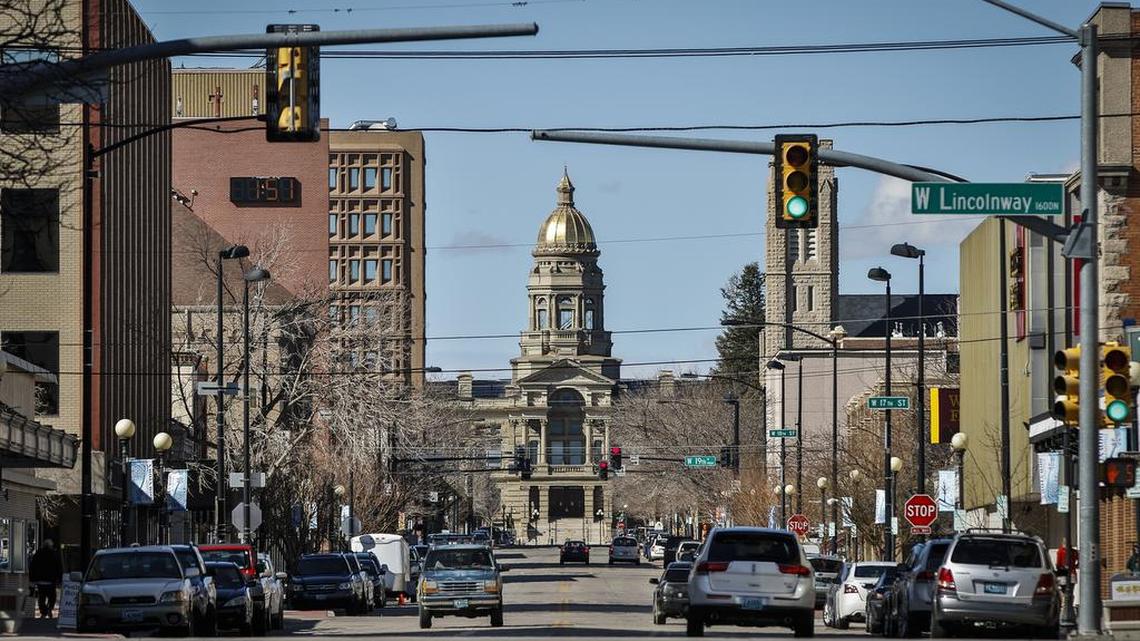 The Wyoming State Capitol building framed by downtown Cheyenne, Wyo. on March 8, 2016. Wyoming is the least populous and the second least densely populated of the 50 United States but a very popular location for the formation of offshore corporations because one can set up a LLC in Wyoming without one's name having to be in the State Register.