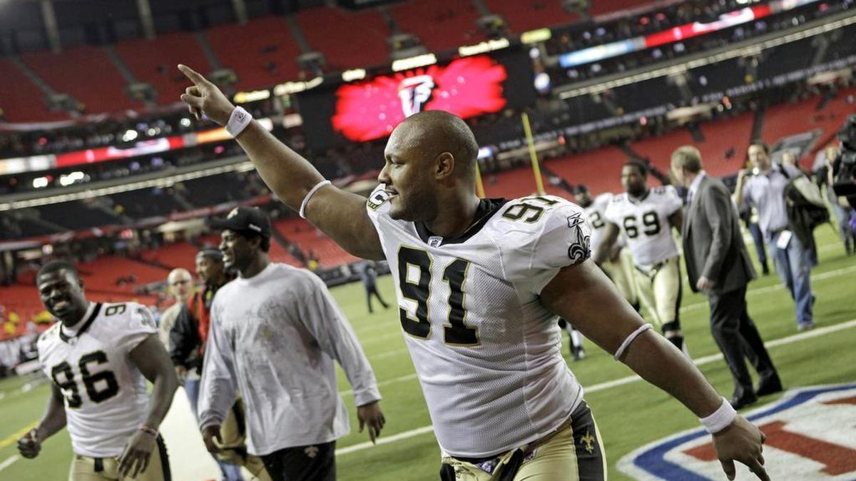 New Orleans Saints defensive end Will Smith (91) celebrates a 17-14 win over the Atlanta Falcons in an NFL football game in Atlanta on Dec. 27, 2010. Smith was fatally shot after a traffic accident in New Orleans.