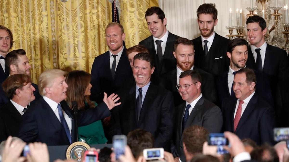 President Donald Trump acknowledges hockey star Sidney Crosby, top row far right, during a ceremony to honor the 2017 NHL Stanley Cup Champion Pittsburgh Penguins, Tuesday Oct. 10, 2017, in the East Room of the White House in Washington.
