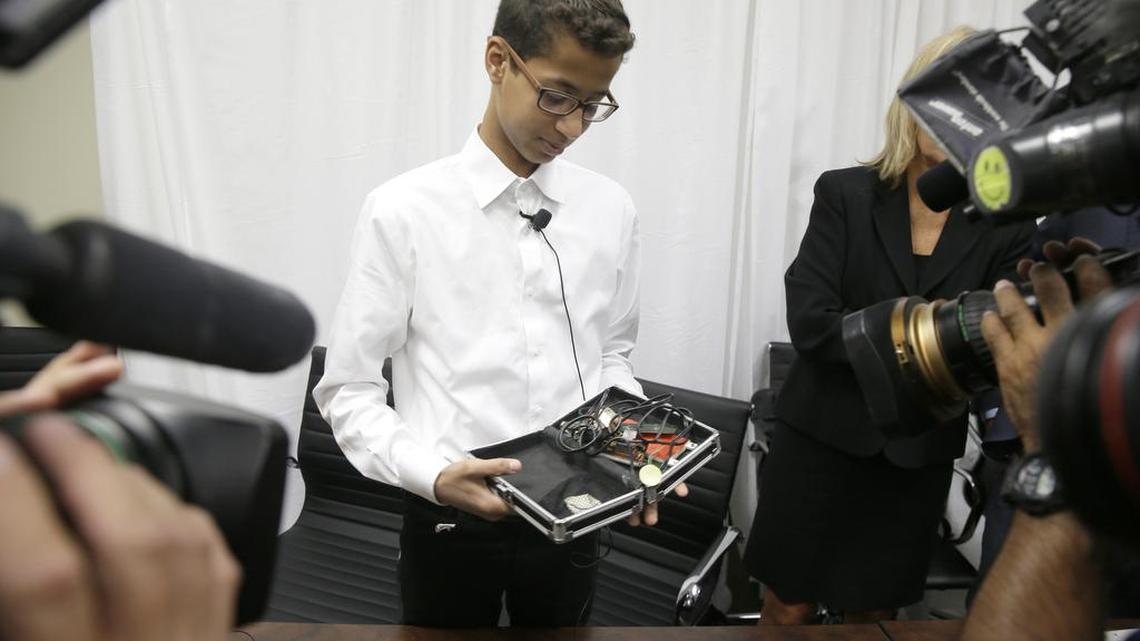 Ahmed Mohamed shows the clock he built in a school pencil box at a Monday news conference.