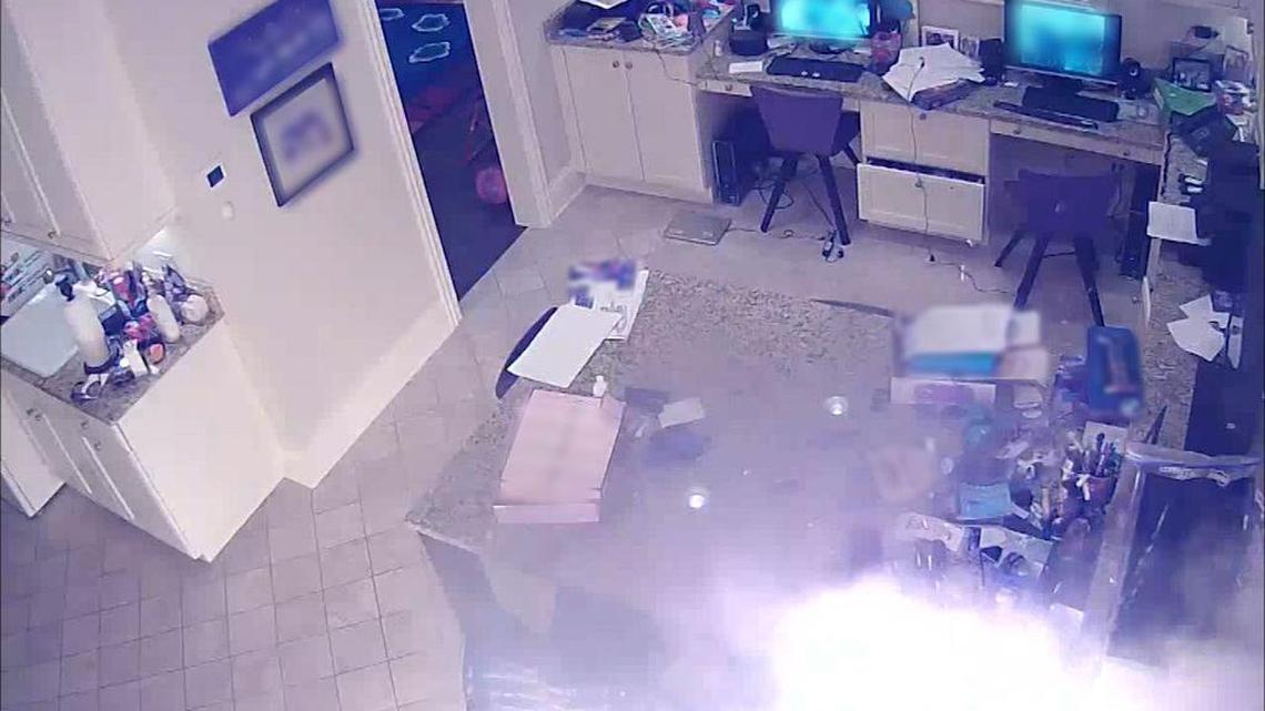 A security camera frame grab shows a hoverboard igniting a fire that caused extensive damage to a home in Highland Park, Ill.