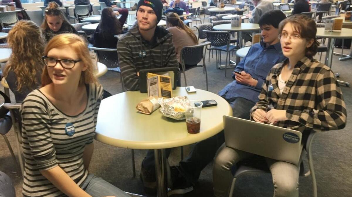Students Molly Rose,Tim Pearson and Megan Roche explain why they are supporting Bernie Sanders for president at the University of New Hampshire, in r Durham, N.H., on Feb. 4, 2016.