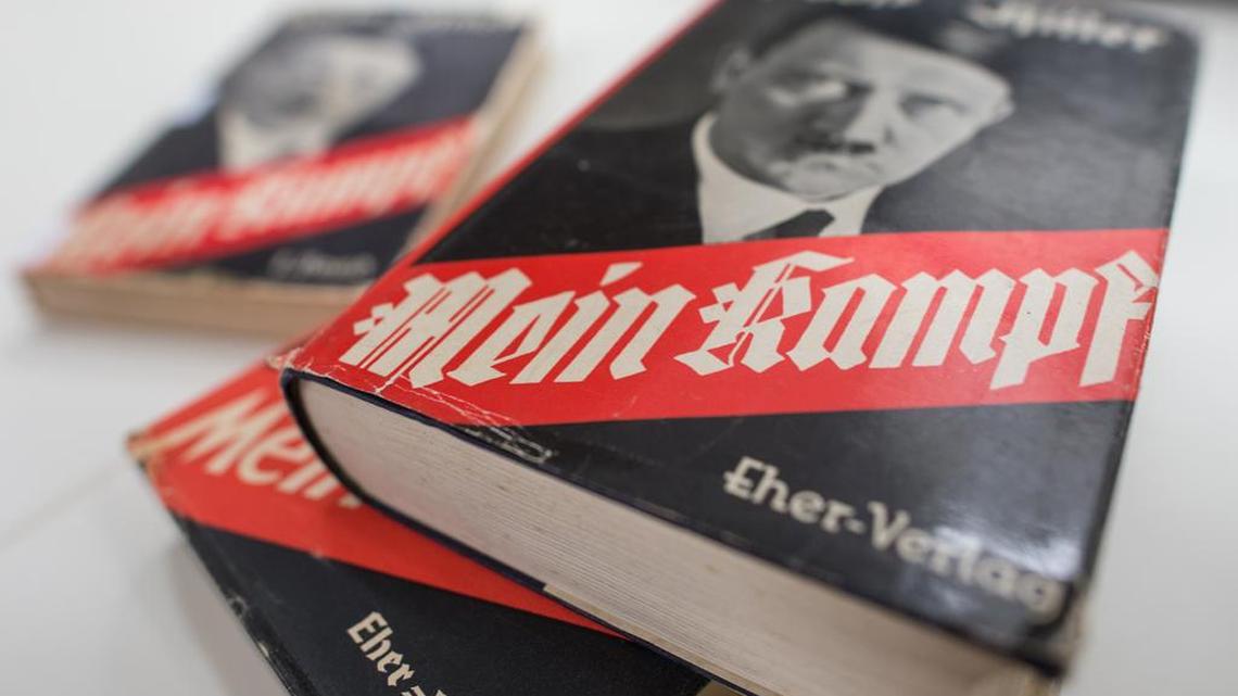 Different editions of Adolf Hitler’s “Mein Kampf” are on display at the Institute for Contemporary History in Munich. A Boston-based publishing company has decided to donate proceeds from Adolf Hitler’s manifesto to a local organization that works with aging Holocaust survivors.