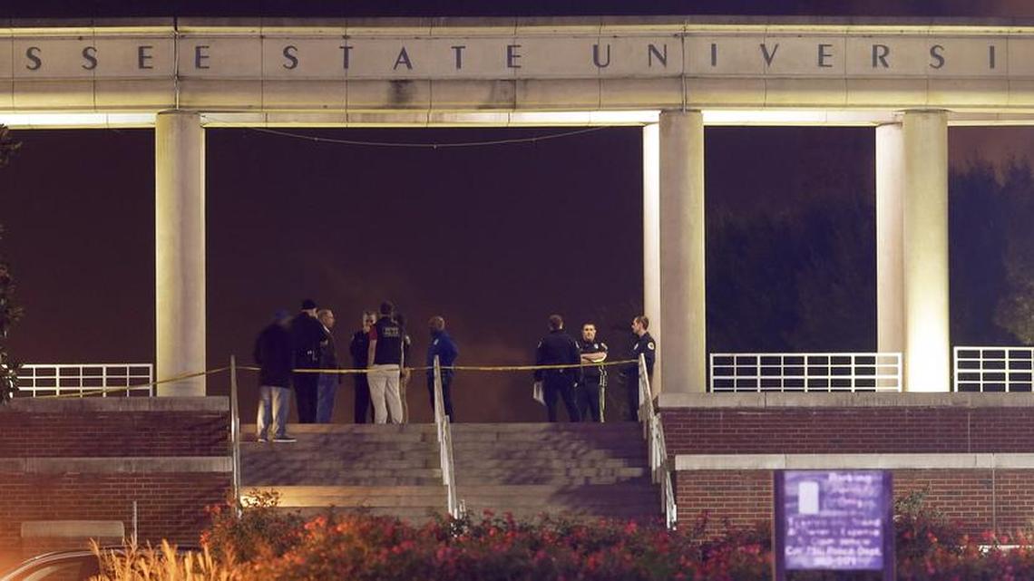 Officials investigate the scene of a shooting on the campus of Tennessee State University, early Friday, Oct. 23, 2015, in Nashville, Tenn.