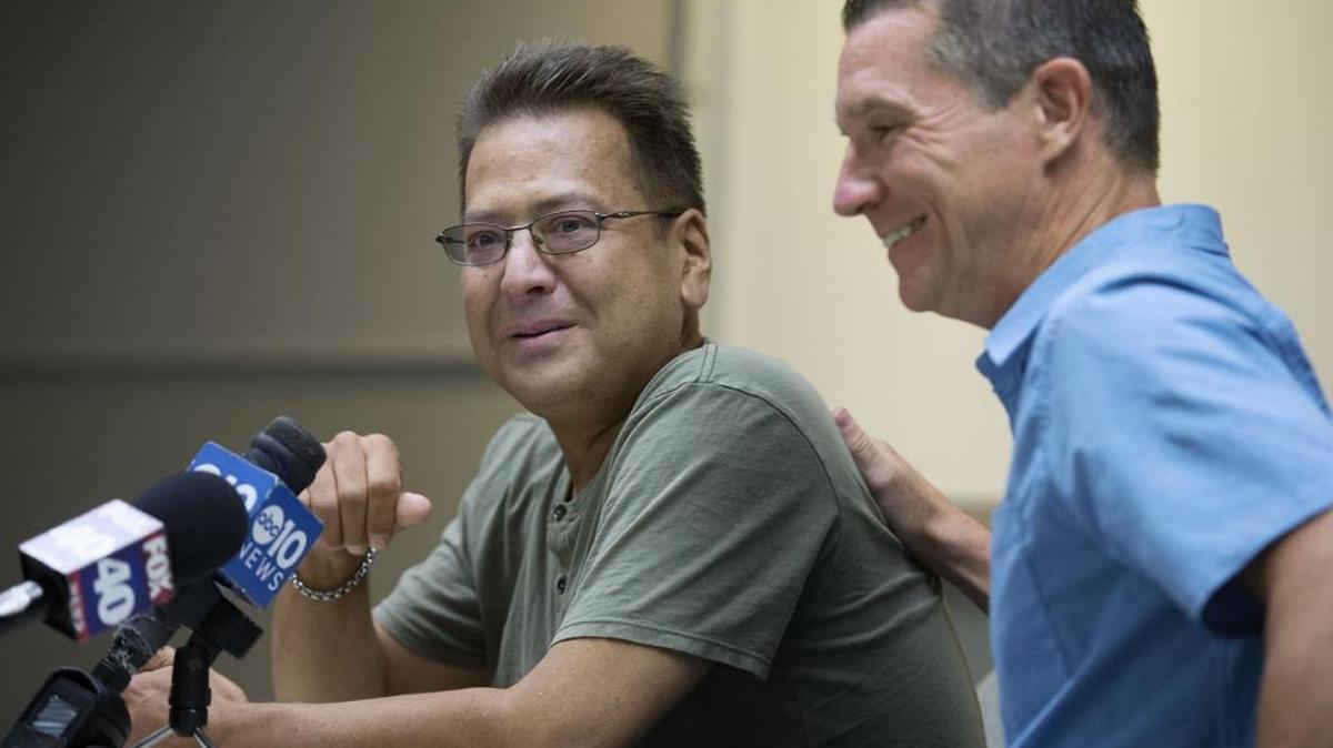 Sacramento County sheriff’s Deputy Nathan Wise, left, talks about the kidney he received from Folsom police Sgt. Eric Baade, right, on Thursday.