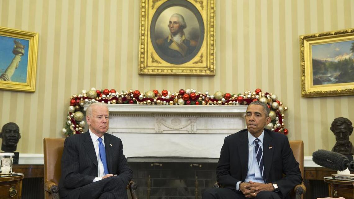 President Barack Obama, accompanied by Vice President Joe Biden, pauses Thursday in the Oval Office while making a statement on Wednesday’s mass shooting in San Bernardino, Calif.