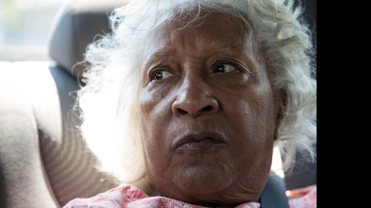 Dr. Helena Hicks gazes out the window while riding around the Sandtown-Windchester neighborhood of Baltimore on May 4, 2015.