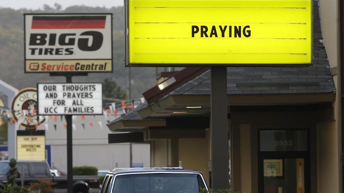 
Signs calling for prayers and remembrance for those killed in a fatal shooting at Umpqua Community College are seen on a pair of local businesses, Saturday, Oct. 3, 2015, in Roseburg, Ore. Armed with multiple guns, Chris Harper Mercer, 26, walked in a classroom at the community college, Thursday, and opened fire, killing several and wounding several others.
