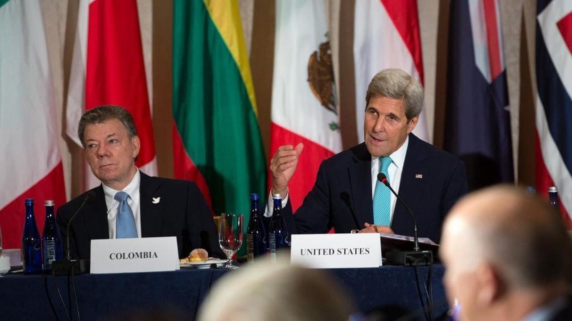 U.S. Secretary of State John Kerry, right, speaks during the Global Demining Initiative for Colombia meeting with President Juan Manuel Santos of Colombia on Sept. 18, 2016, in New York. The State Department says difficult decisions are ahead for Colombia now that voters voted against a proposed peace deal with FARC rebels. (AP Photo/Kevin Hagen)